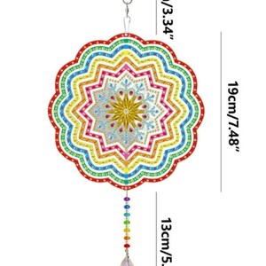 May include: A rainbow colored mandala wind chime with a crystal teardrop hanging from the bottom. The mandala is 7.48 inches in diameter and the chime is 13 inches long.
