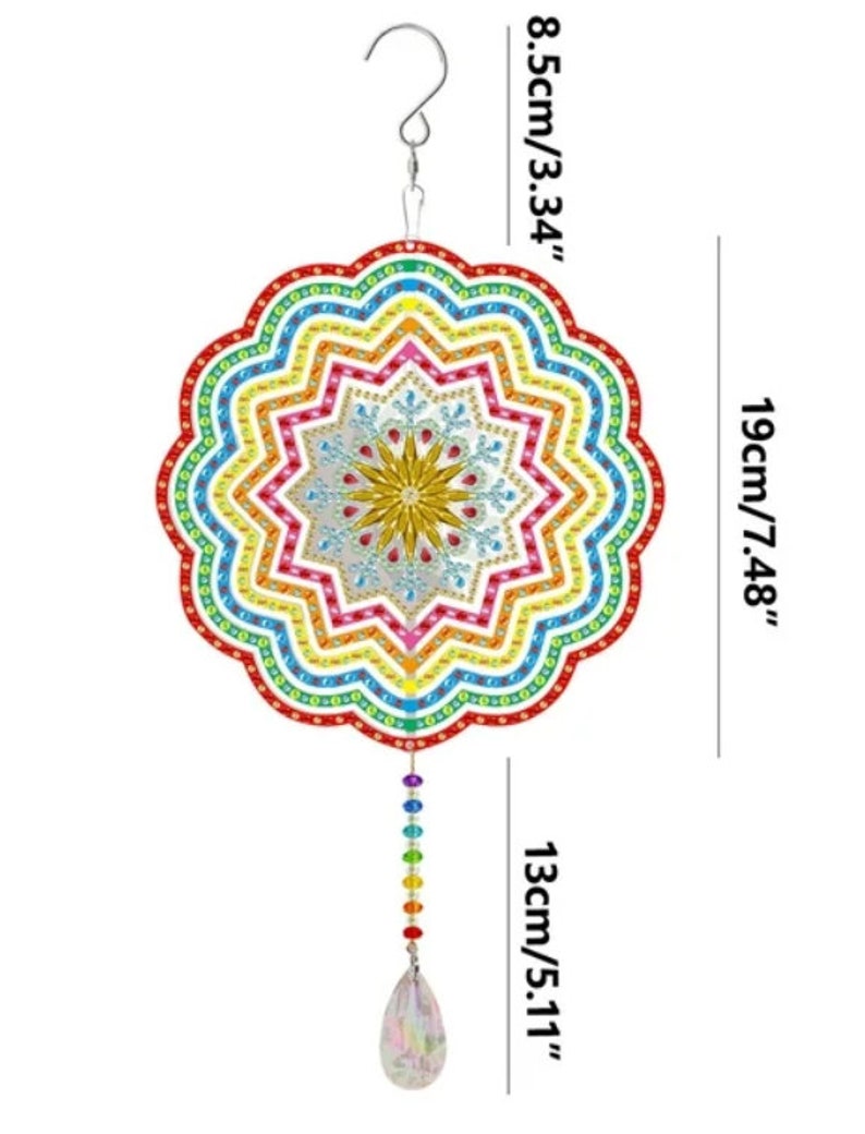 May include: A rainbow colored mandala wind chime with a crystal teardrop hanging from the bottom. The mandala is 7.48 inches in diameter and the chime is 13 inches long.