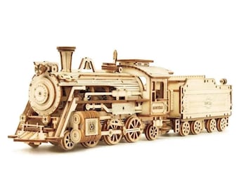 May include: A detailed wooden model of a steam train, featuring intricate cut-out designs. The model includes a locomotive and a tender car, all crafted from light-colored wood. The train has multiple wheels and detailed mechanical components.