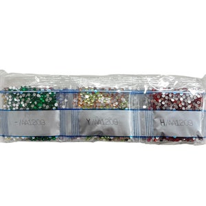 May include: Three small, clear plastic bags filled with colorful, sparkling rhinestones. The bags are labeled with letters and numbers. The rhinestones are in shades of green, gold, and red. The bags are sealed together.