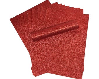 May include: A stack of red glitter cardstock paper. The paper is perfect for crafting and scrapbooking.