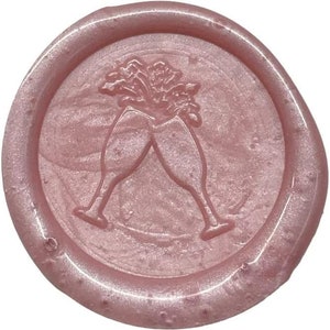 May include: A pink wax seal with a design of two champagne glasses clinking together.
