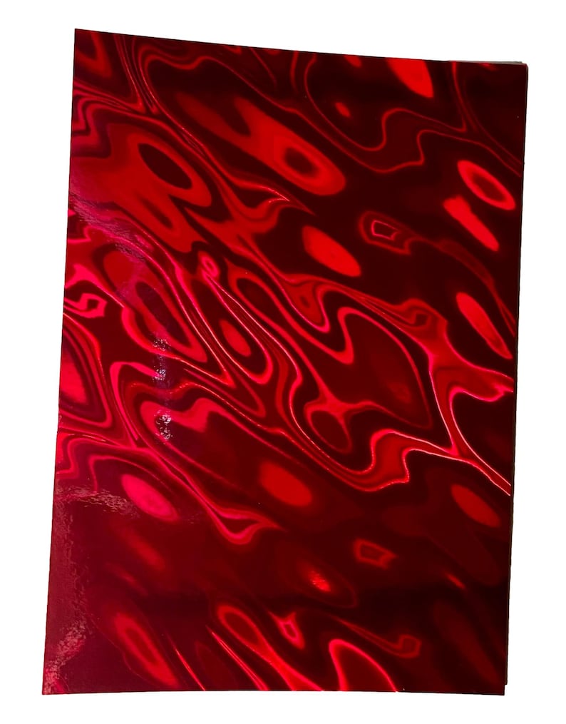 May include: A rectangular sheet of material featuring a vibrant red holographic finish. The surface displays a dynamic, liquid-like pattern of swirling light and dark red waves that create a reflective, metallic appearance across the entire area.