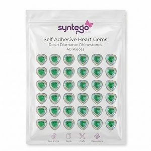 May include: A clear plastic bag containing 40 heart-shaped, self-adhesive resin diamante rhinestones. Each gem has a green center and a silver-colored border. The bag has the text "syntego" and "Self Adhesive Heart Gems".