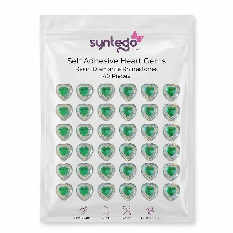 May include: A clear plastic bag containing 40 heart-shaped, self-adhesive resin diamante rhinestones. Each gem has a green center and a silver-colored border. The bag has the text "syntego" and "Self Adhesive Heart Gems".