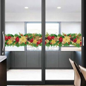 May include: A pair of glass doors with a Christmas-themed window cling featuring red ornaments, gold stars, and green pine branches.