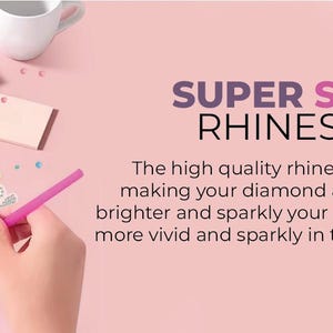 May include: A close-up of a diamond painting kit with a pink butterfly design. The kit includes a pink tool for placing rhinestones, a pink pouch, and a pink background. The text "SUPER SPARKLY RHINESTONES" is displayed on the pink background. The text below the title reads: "The high quality rhinestones have 26 facets, making your diamond art look more colourful, brighter and sparkly your diamond painting will be more vivid and sparkly in the light and will not fade."