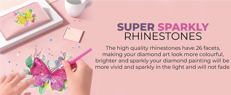 May include: A close-up of a diamond painting kit with a pink butterfly design. The kit includes a pink tool for placing rhinestones, a pink pouch, and a pink background. The text "SUPER SPARKLY RHINESTONES" is displayed on the pink background. The text below the title reads: "The high quality rhinestones have 26 facets, making your diamond art look more colourful, brighter and sparkly your diamond painting will be more vivid and sparkly in the light and will not fade."
