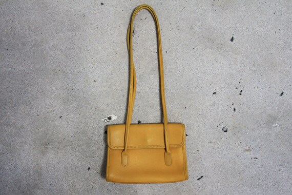 mustard coach purse