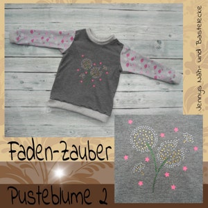 May include: A gray sweatshirt with a design of three white dandelions with pink stars on a gray background. The text "Faden-Zauber Pusteblume 2" is on the bottom of the image.