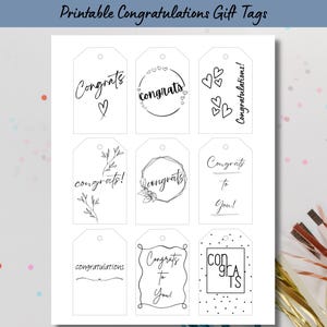 May include: A sheet of printable gift tags with the text "Printable Congratulations Gift Tags" at the top. The tags feature various designs with the word "Congrats" and "Congratulations" in black script and decorative elements.