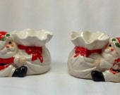 Vintage Fitz Floyd FF Santa Clause Hugging Sack Figurine Christmas Holiday Taper Candle Candlestick Holder Porcelain Set Red Bow Holly Pair