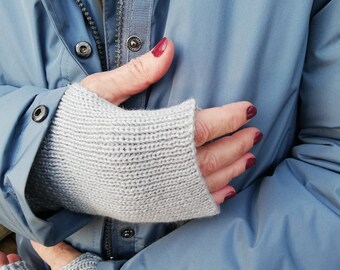 Cuffs, wrist warmers with thumb holes knitted in merino wool