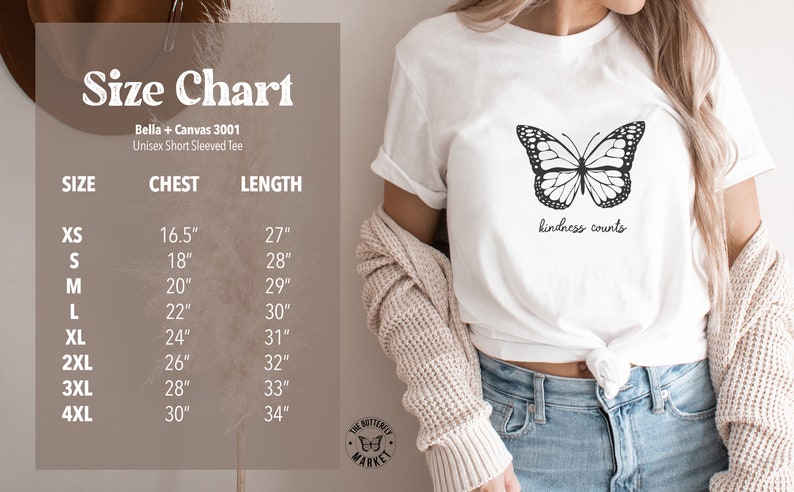 May include: Size chart for a white unisex short-sleeved t-shirt with a black butterfly graphic and the text "kindness counts". The chart shows sizes XS through 4XL with corresponding chest and length measurements in inches.