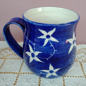 coffee mug blue daisies tea cup blue flowers on white stoneware
