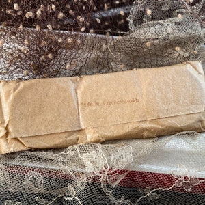 May include: A brown paper package with the text "Made in Czechoslovakia" printed on it.