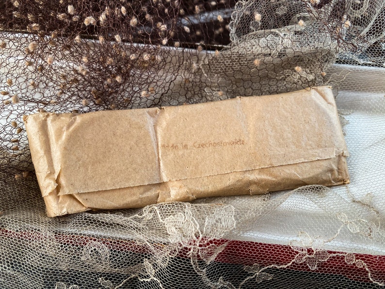 May include: A brown paper package with the text "Made in Czechoslovakia" printed on it.