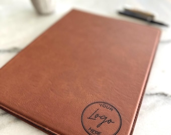 May include: A brown leather portfolio with a circle logo that says "Your Logo Here".