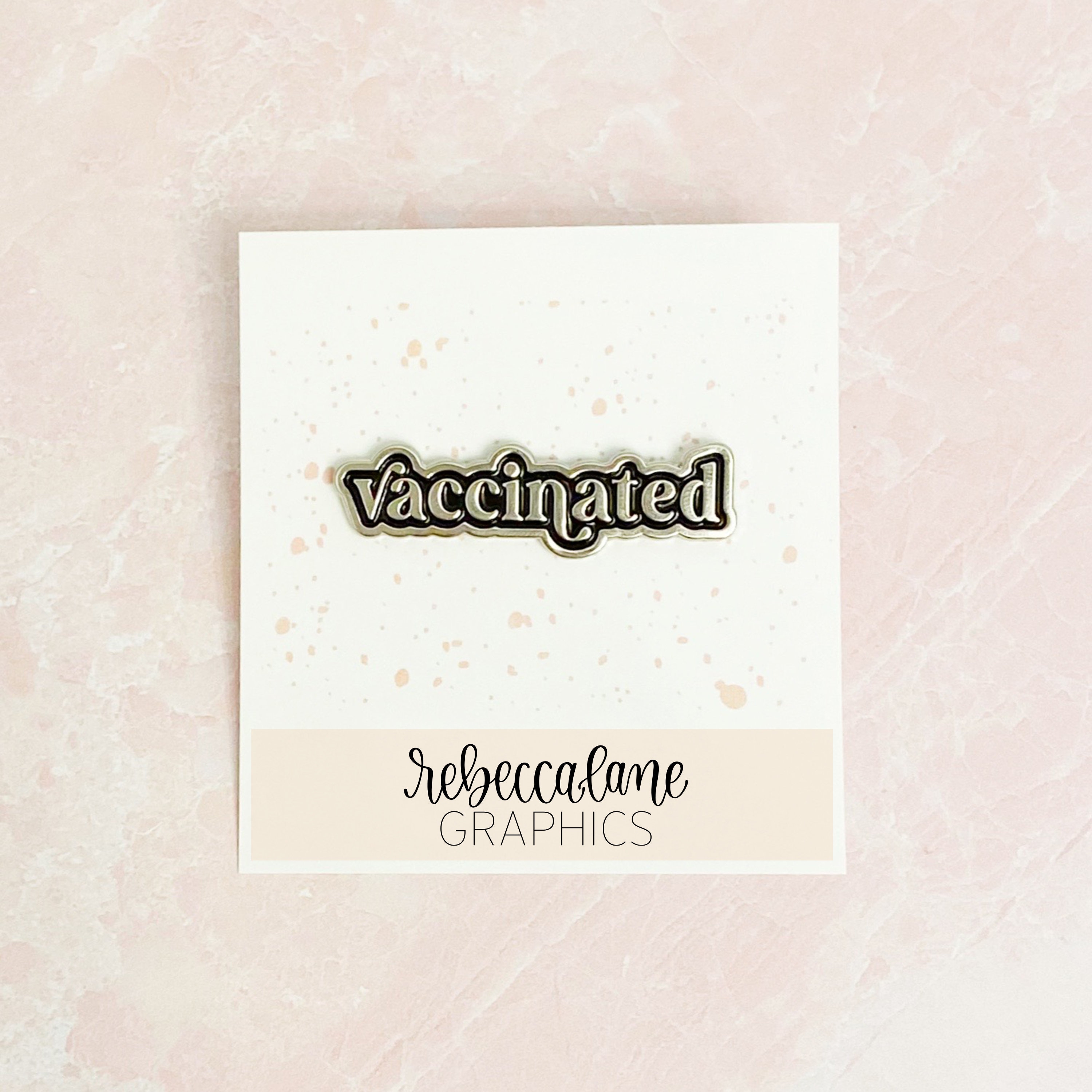 vaccinated enamel pin - silver + black