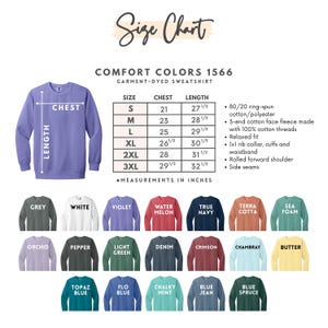 May include: A Comfort Colors 1566 garment-dyed sweatshirt size chart featuring a purple sweatshirt illustration, a table with chest and length measurements in inches for sizes S to 3XL, and a color palette of twenty-one available sweatshirt colors.