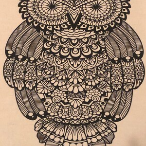 May include: A black and white mandala-style owl illustration. The owl is drawn with intricate details and patterns throughout the body, wings, and face.