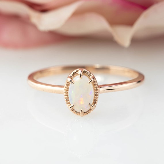 14k White or Yellow Gold 6x4mm Oval Genuine Australian Opal Earrings 14k White or Yellow Gold 6x4mm Oval Genuine Australian Opal Earrings