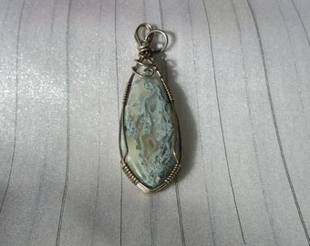Moss Agate cabochon wrapped in antiqued Sterling Silver wire
