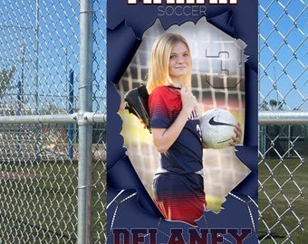 May include: A blue and white soccer banner with a photo of a girl holding a soccer ball. The banner says "MAHAR SOCCER" and "DELANEY SMITH 2021".