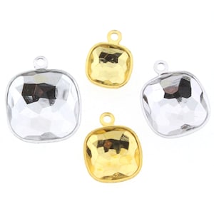 May include: Six square-shaped pendant settings with a hammered texture. Three are gold-toned and three are silver-toned.