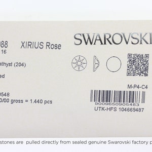 May include: A close-up of a white card with black text. The card is labeled "2088 XIRIUS Rose SS 16 Amethyst (204) Foiled 5090548 10/00/00 gross = 1.440 pcs" and "SWAROVSKI M-P4-C4 9009650905483 UTK-HFS 104669487". The card also includes a barcode and a QR code.