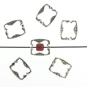 May include: Five silver-toned, open-frame pendants with a textured surface and a square shape. One pendant features a red gemstone. The pendants are arranged around a black cord against a white background.