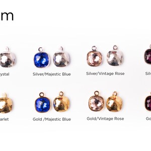 May include: Eight millimeter square-shaped crystal charms with a hammered metal setting.  The charms are available in silver or gold with a variety of colors including crystal, majestic blue, vintage rose, and amethyst.