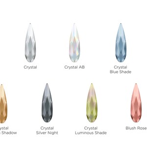 May include: A selection of teardrop-shaped crystal beads in various colors, including clear, iridescent, blue, gold, silver, green, and blush rose.
