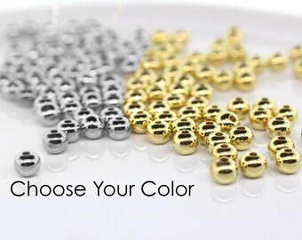 May include: A close-up of two piles of round beads. One pile is silver and the other is gold. The text "Choose Your Color" is visible at the bottom of the image.