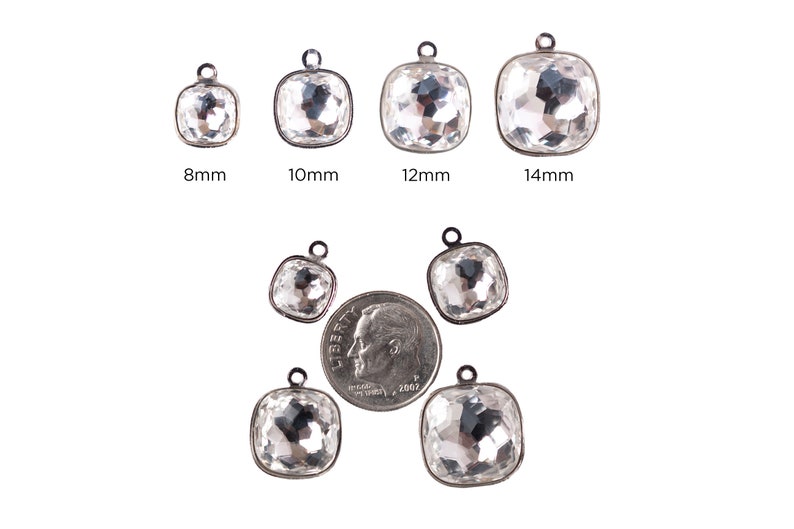 May include: Assortment of clear crystal square charms with silver settings in various sizes: 8mm, 10mm, 12mm, and 14mm. The charms are shown next to a US dime for size comparison.