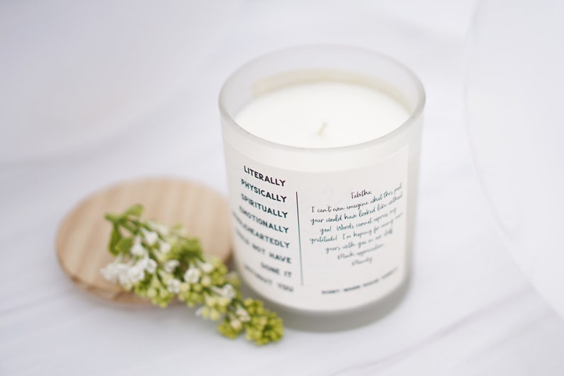 May include: White candle in a glass jar with a white label that reads "Literally, Physically, Spiritually, Emotionally, Wholeheartedly, I Don't Have Time For You". The label also includes a handwritten message that reads "Talitha, I can't even express what this gift you would have loved like nothing you've ever looked at, your words, cannot express my gratitude. I'm hoping for many years with you in my life. Much appreciation, Brandy".