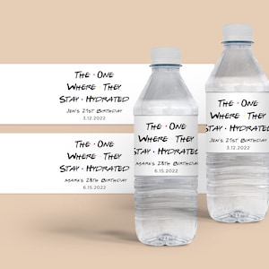 May include: Water bottle labels with a Friends TV show theme. The labels feature the text "The One Where They Stay Hydrated" with a birthday name and date.