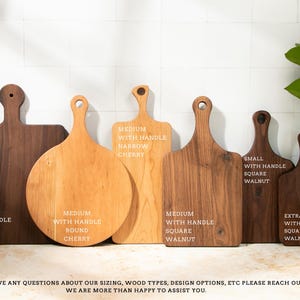 a group of wooden cutting boards sitting on top of a counter