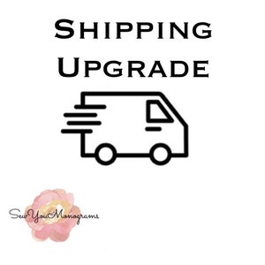 May include: Black and white illustration of a delivery truck with the text "SHIPPING UPGRADE" above it.
