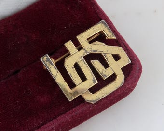 Broche antiguo de plata de ley chapado en oro de la USO (Organización de Servicios Unidos) de la Segunda Guerra Mundial.