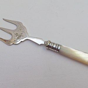 Antique silver plated bread fork