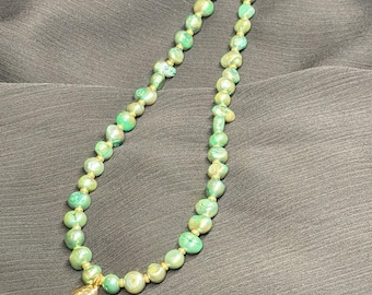 Green pearl Oceanus necklace with gold filled claw pendant