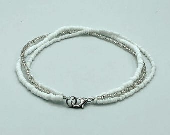 Simple anklet with multiple strands. White and silver beaded ankle bracelet.