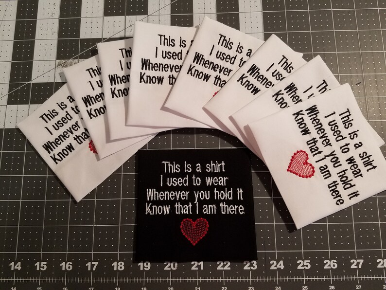 May include: A set of white fabric patches with the text "This is a shirt I used to wear Whenever you hold it Know that I am there."  A black fabric patch with the same text and a red heart.