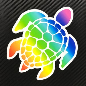 May include: A rainbow colored sea turtle sticker with a white outline. The turtle is facing right and has a detailed shell.
