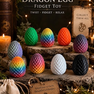 May include: A collection of colorful dragon egg fidget toys. The eggs are in various colors, including green, rainbow, orange, purple, pink, white, and black. The text "DRAGON EGG FIDGET TOY" is displayed above the eggs. The text "COLLECT THEM ALL" is also visible.