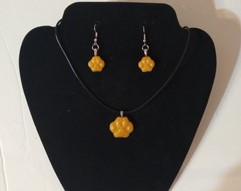 gold paw print necklace and earrings