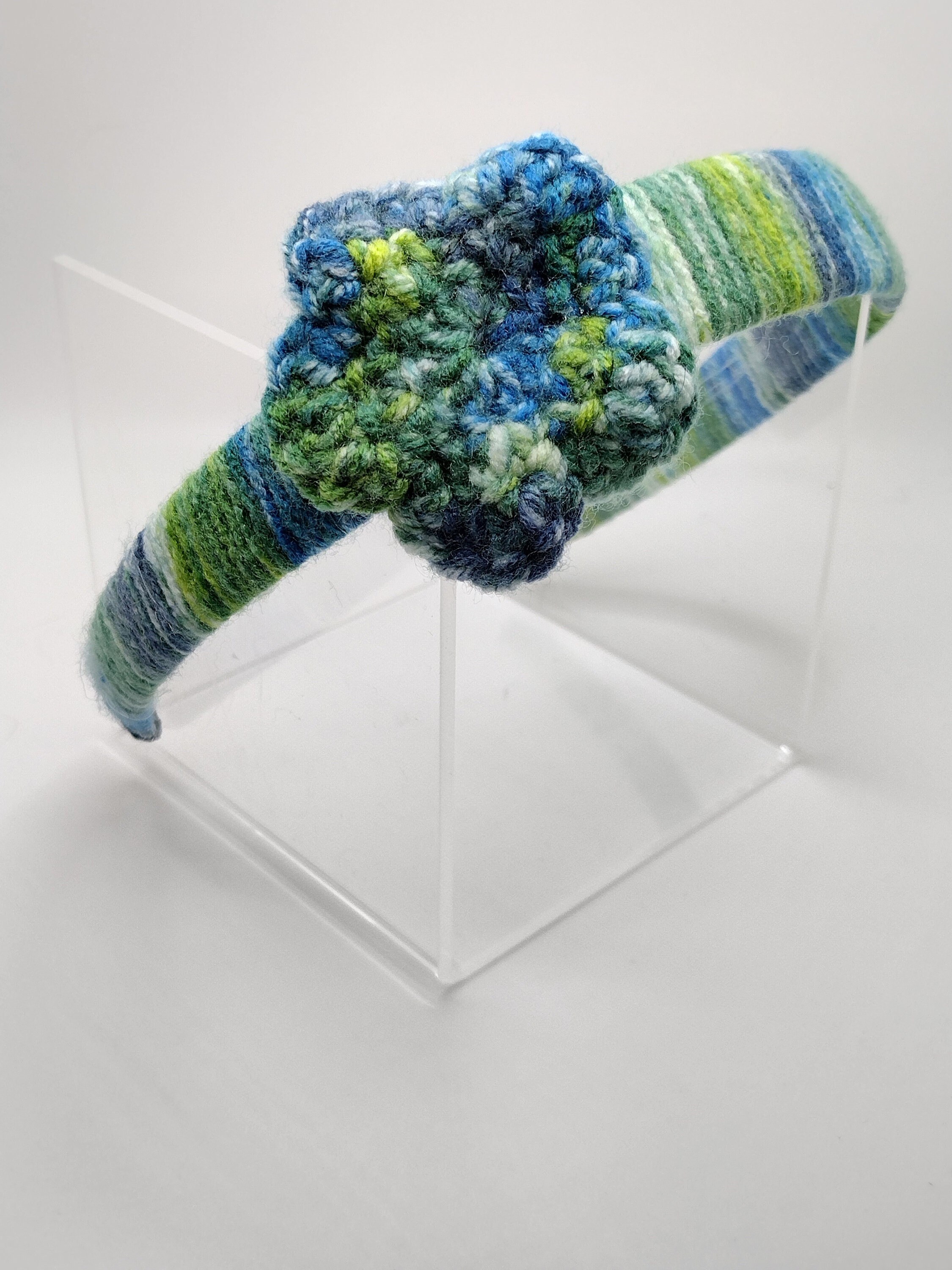 blue and green multicolored off center crochet flower headband
