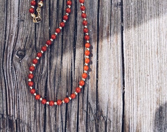 Coral paste choker and golden steel beads