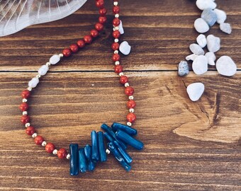 Necklace with red coral, gold hematite, freshwater pearls and turquoise paste chips